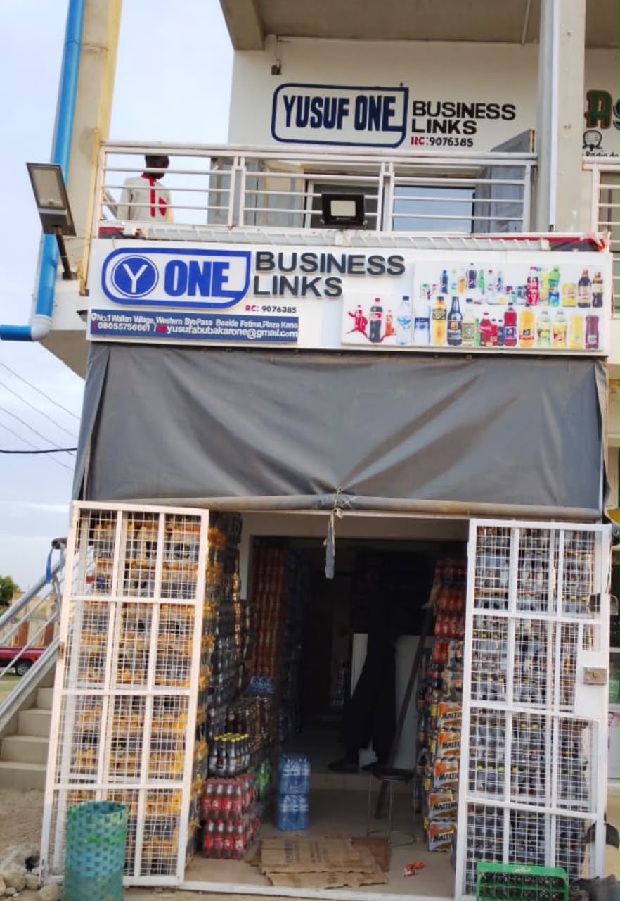 Yusuf One Business Links storefront and signage at the Kano head office