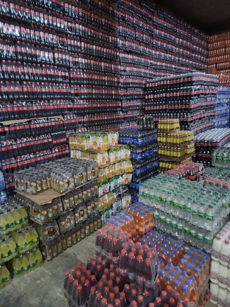 Assorted beverage brands stocked across the warehouse