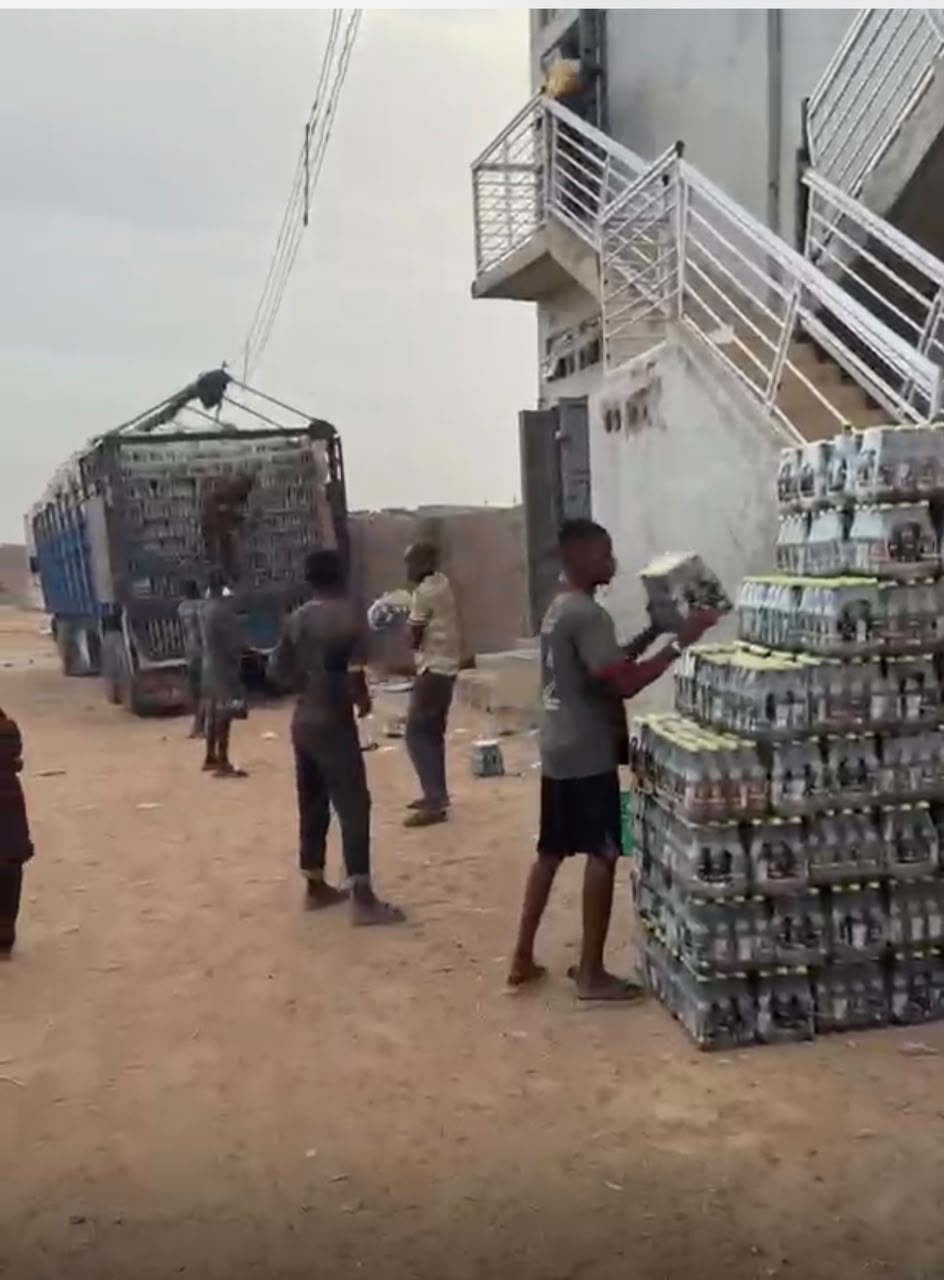 Warehouse team unloading crates from a delivery truck